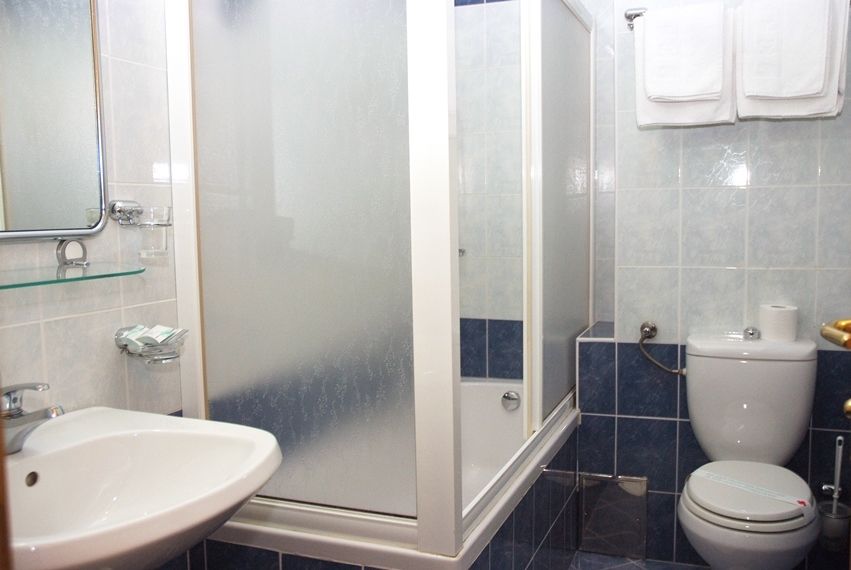 En-suite bathroom with shower, sink and toilet